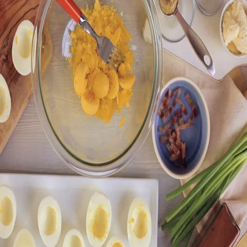 Preparing deviled eggs with organic eggs for appetizer. Step by step recipe. Video stock 69728739