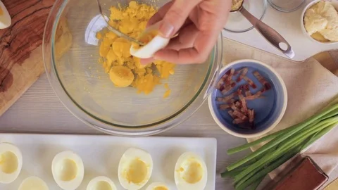 Preparing deviled eggs with organic eggs for appetizer. Step by step recipe. Video stock 69728840