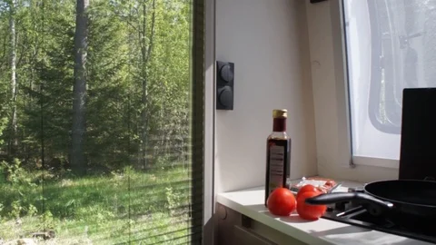 Preparing Dinner In Caravan Kitchen Stock Footage 97203095