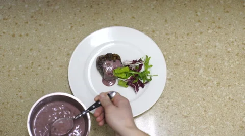 Preparing dish plate of beef steak and salad at kitchen in restaurant Stock Footage 61896117