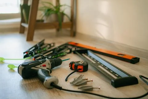 Preparing for a diy home improvement project, mounting a tv bracket with power Stock Photos