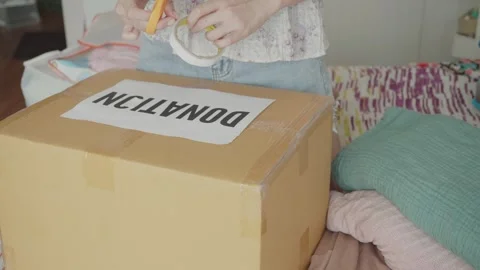 Preparing a Donation Package Stock Footage 315975153