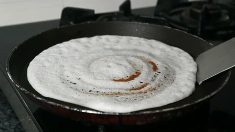 Preparing dosa breakfast Stockbeeldmateriaal 237333579