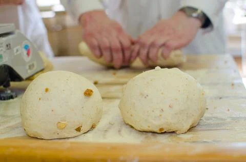 Preparing dough in a bakery. Stock Photos