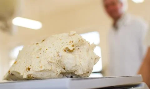 Preparing dough in a bakery. Stock Photos