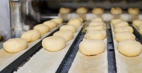 Preparing dough in a bakery. Stock Photos