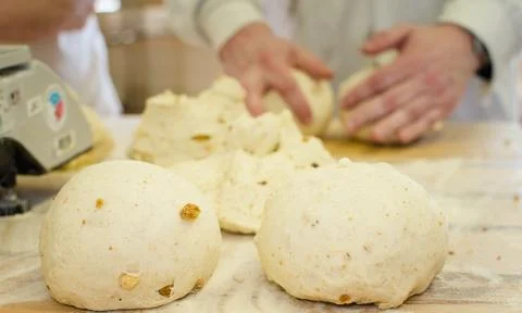 Preparing dough in a bakery. Stock Photos
