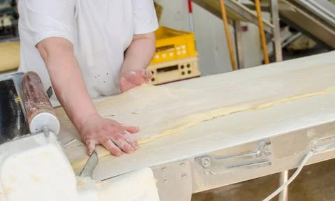 Preparing dough in a bakery. Stock Photos