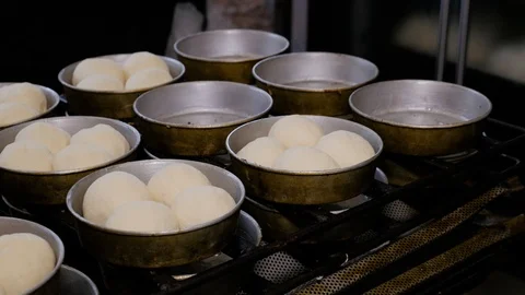 Preparing dough for baking buns. Baking buns in industrial restaurant kitchen. Stock Footage 108097173