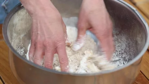 Preparing dough base for custard cream cake Stock Footage 133750033