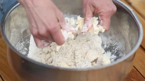 Preparing dough base for custard cream cake Stock Footage 133750043