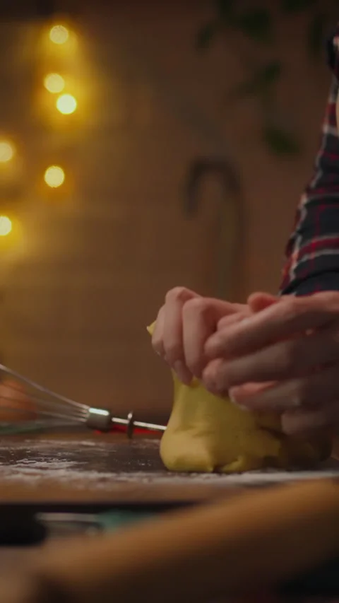 Preparing dough with care in a cozy kitchen during the evening Stock Footage 331721090