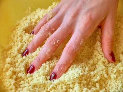 Preparing the dough for a crumble Stock Photos
