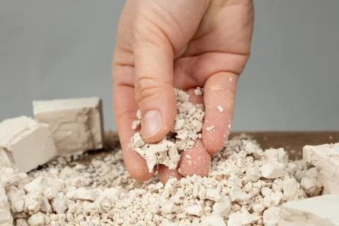 Preparing Dough by Crumbling Fresh Compressed Yeast. Stock Photos