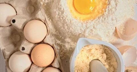Preparing dough with flour, eggs and butter. Flat lay. Stock Footage 261149414