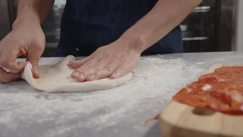 Preparing the dough for pizza Video stock 244950544