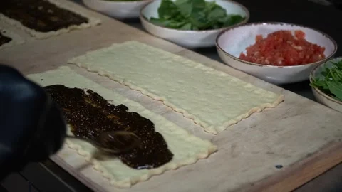 Preparing Dough with Sauce Stock Footage 319950568