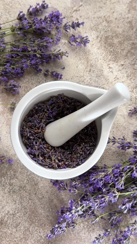 Preparing dried lavender flowers in mortar Stock-Footage 340146414