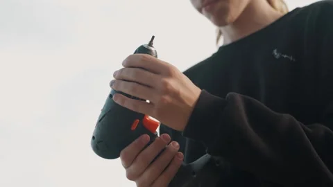 Preparing drill for construction work. Closeup of hands controlling power tool Stock Footage 334946320