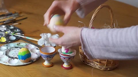Preparing Easter Basket with Multiple Hand-Crafted Eggs Stock Footage 329248212