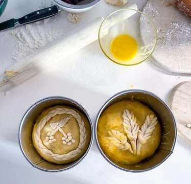 Preparing easter bread dough decorated with wheat and berries 스톡 사진