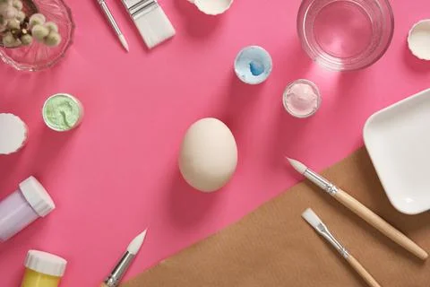 Preparing for Easter celebrations. Coloring Easter eggs with gouache. Clean l Stock Photos