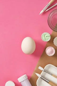 Preparing for Easter celebrations. Coloring Easter eggs with gouache. Clean l Stock Photos