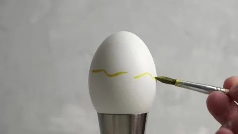 Preparing for Easter. Close-up of hands painting Easter eggs Stock Footage 172091218