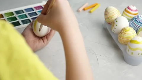 Preparing for Easter. Close-up of hands painting Easter eggs Stock Footage 172091263