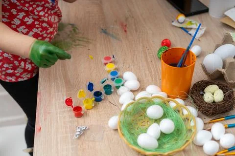 Preparing easter eggs for dyeing during spring holidays with paints and dec.. Stock Photos