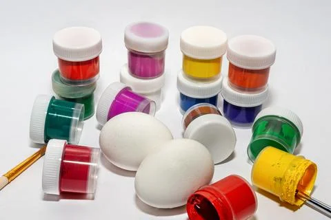 Preparing for the Easter holiday. Coloring fresh eggs Stock Photos