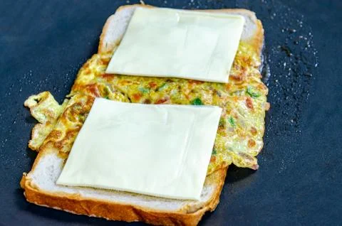 Preparing an Egg Sandwich Stock Photos