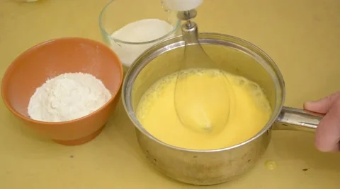 Preparing egg sponge - beating up sugar and whipped eggs Stock Footage 45820367