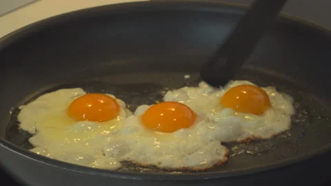 Preparing eggs in kitchen Stock Footage 144961438