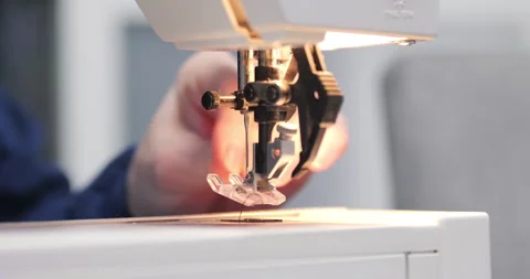 Preparing electric sewing machine for work 5.7K video Stock Footage 300656705