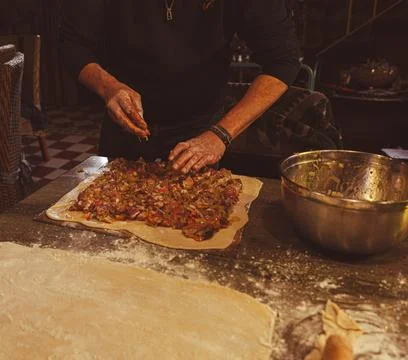 Preparing an empanada Stock Photos