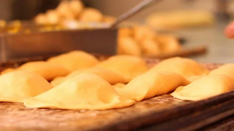 Preparing empanadas before putting them in the oven 스톡 동영상 130083773