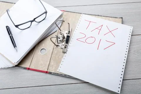Preparing an empty file folder for the tax clearance 2017 Stock Photos