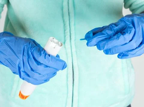 Preparing epinephrine injector to use Stock Photos