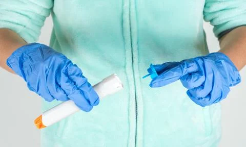 Preparing epinephrine injector to use Stock Photos