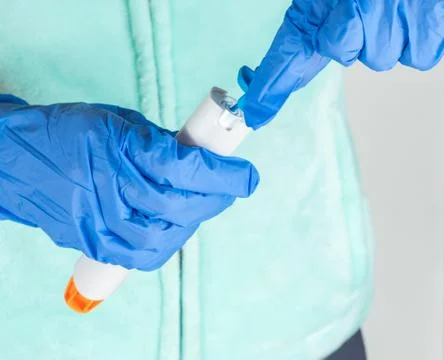 Preparing epinephrine injector to use Stock Photos