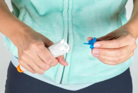 Preparing epinephrine injector to use Stock Photos