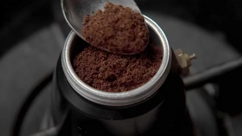 Preparing Espresso Coffee With A Moka Pot on kitchen stove, Close up footage Stock Footage 166086699