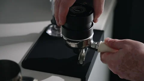 Preparing espresso puck with distribution tool Stock Footage 340274486