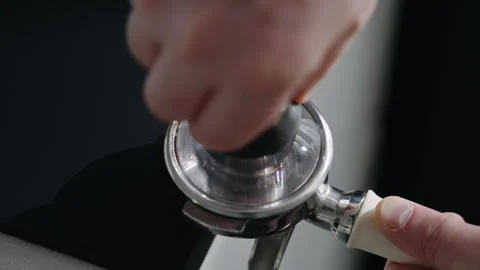 Preparing espresso puck by tamping ground coffee 스톡 동영상 340274460