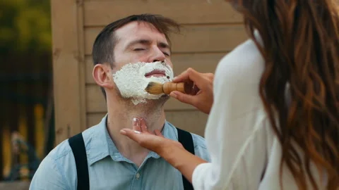 Preparing face with shave foam close-up applying Stock Footage 100176979