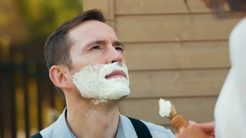 Preparing face with shave foam close-up applying Stock Footage 100177006