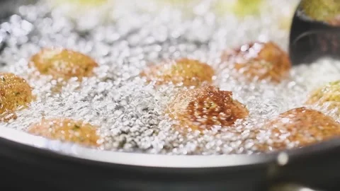 Preparing falafel in a frying pan. Stock Footage 159810764