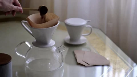 Preparing filter coffe, pouring ground beans Stock Footage 254905239