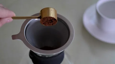 Preparing filter coffe, pouring ground beans Stock Footage 254905311